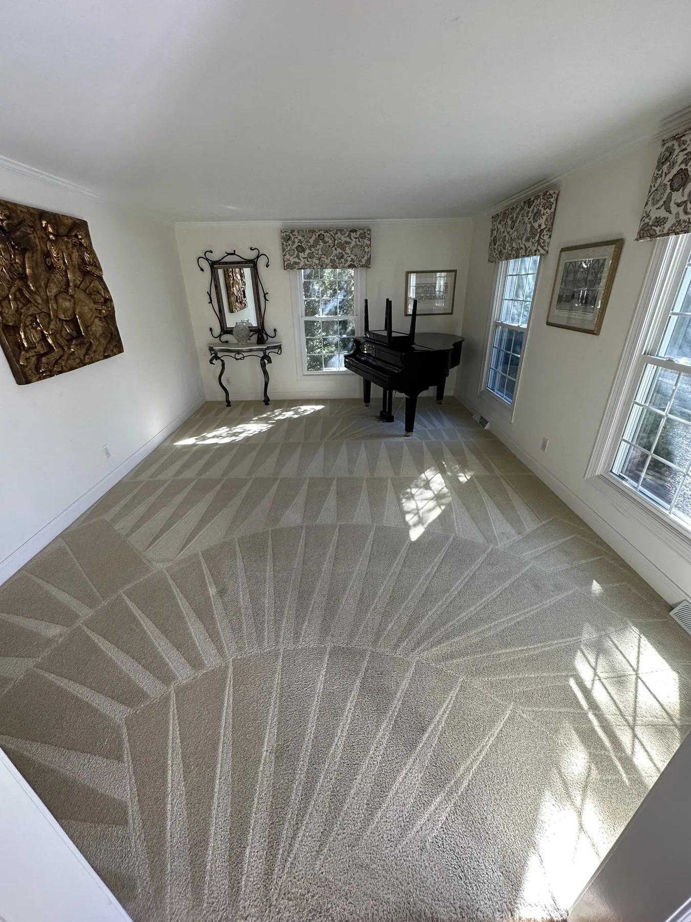The same formal living room carpet with crisp fan pattern lines after cleaning