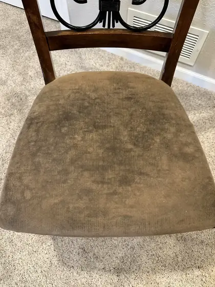 Close up of the dining chair seat showing soiling ground into the fabric pile
