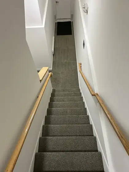 The same stairwell carpet clean and uniform after liquid dry cleaning